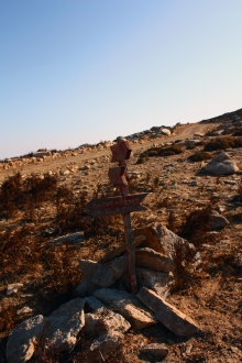 The old hiking sign pointing west